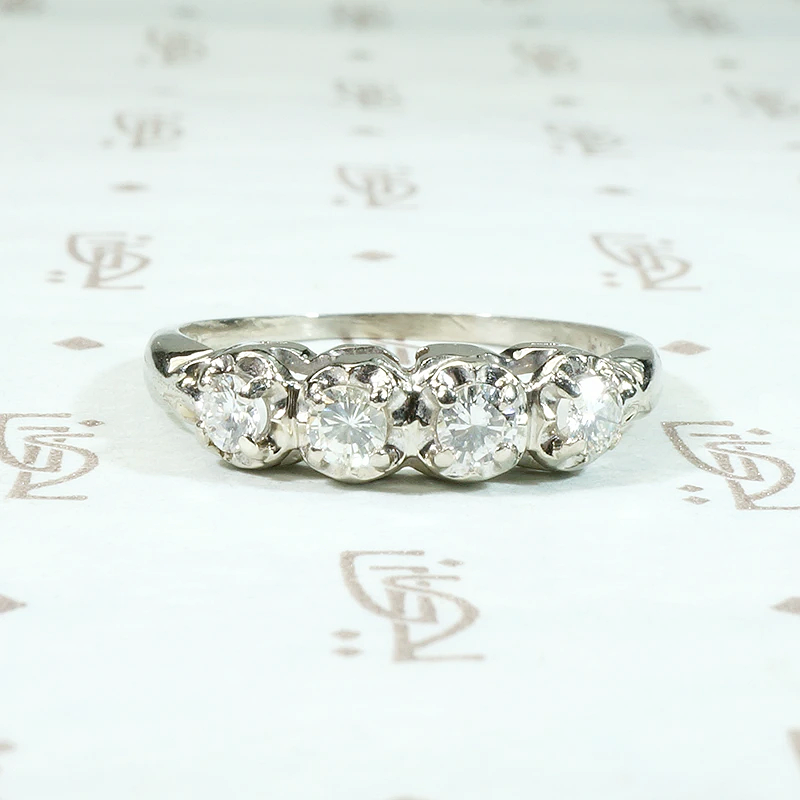 Four Diamonds in Curvaceous White Gold Band