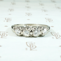 Four Diamonds in Curvaceous White Gold Band