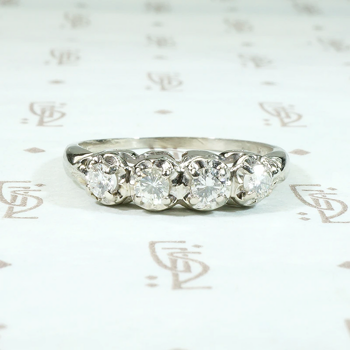 Four Diamonds in Curvaceous White Gold Band