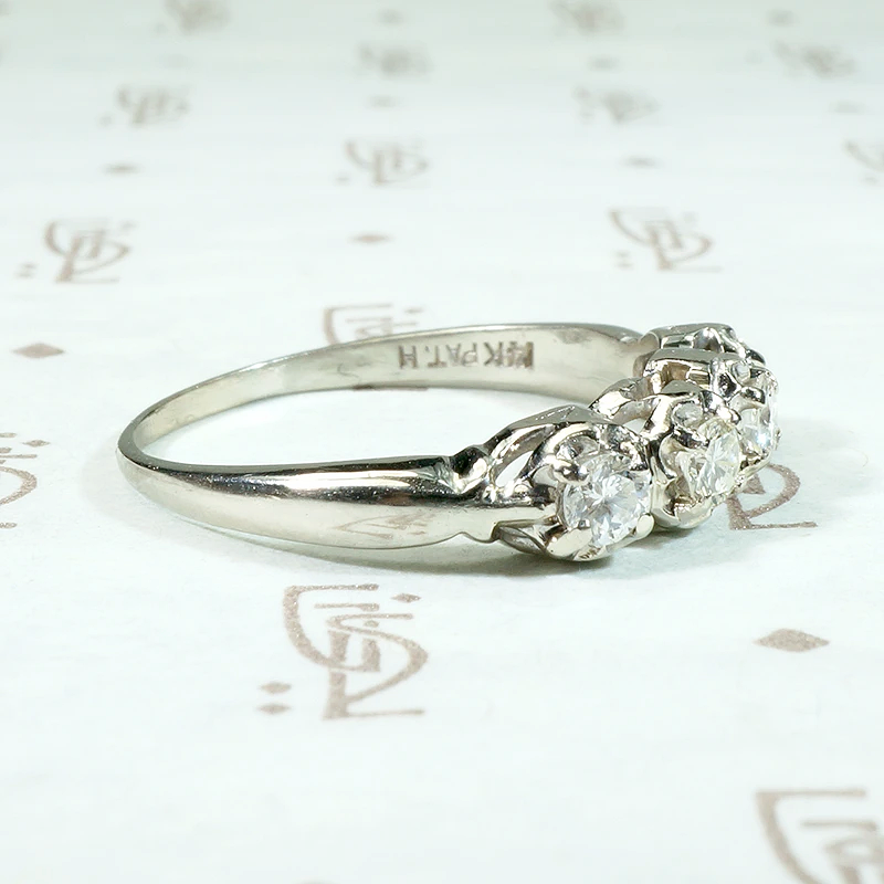 Four Diamonds in Curvaceous White Gold Band