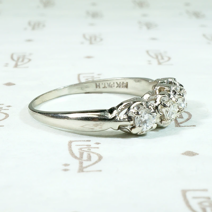 Four Diamonds in Curvaceous White Gold Band