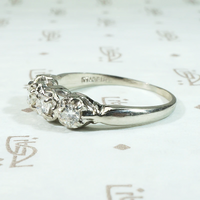 Four Diamonds in Curvaceous White Gold Band