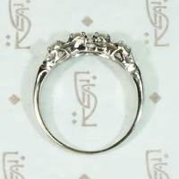 Four Diamonds in Curvaceous White Gold Band