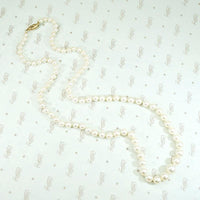 Radiant Strand of Pearls with Gold Clasp