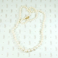 Radiant Strand of Pearls with Gold Clasp