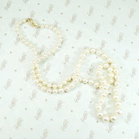 Radiant Strand of Pearls with Gold Clasp