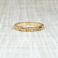 Crisp Detail Faceted Bars & Flowers Gold Band