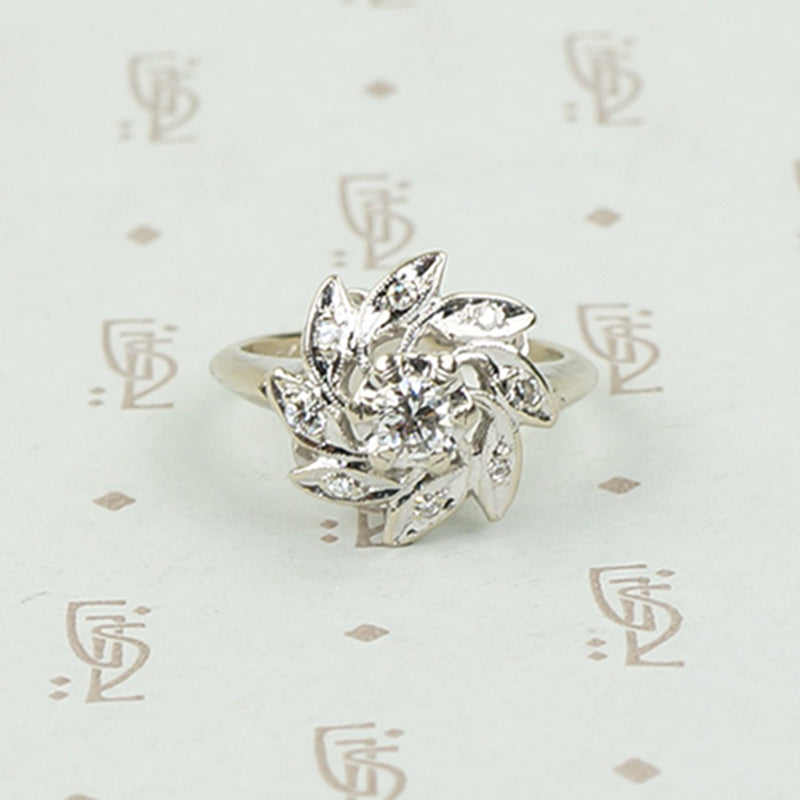 Diamond and White Gold Pinwheel Ring