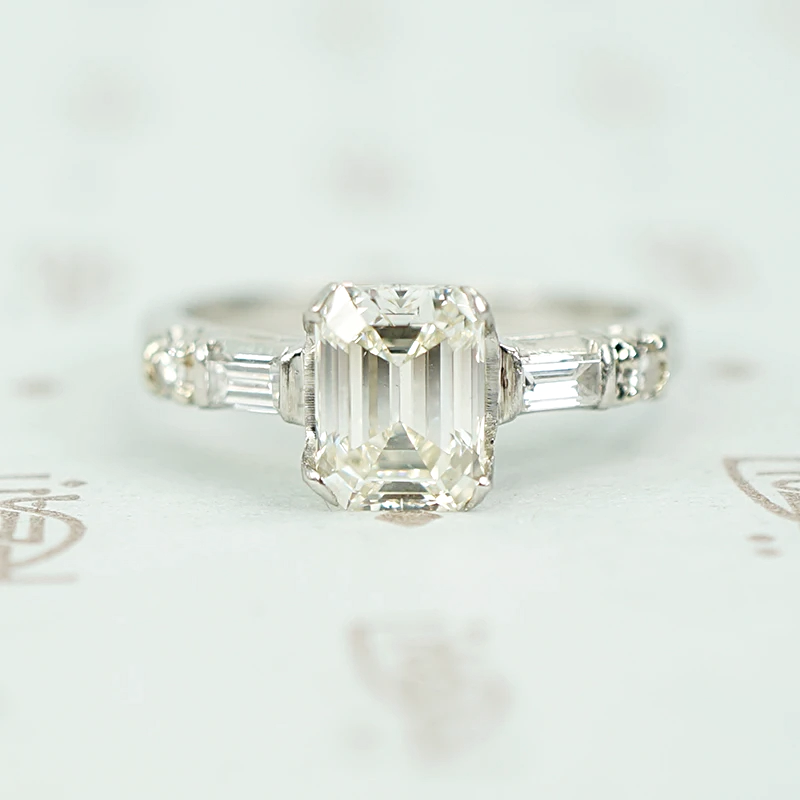 Exceptional Emerald Step Cut Diamond Engagement Ring