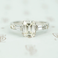 Exceptional Emerald Step Cut Diamond Engagement Ring