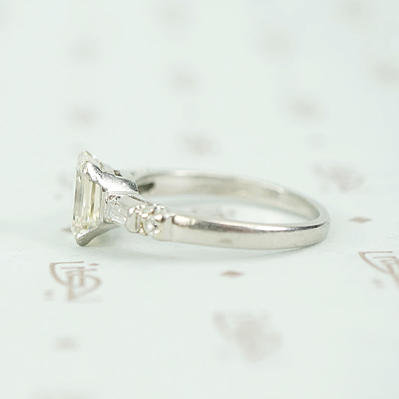 Exceptional Emerald Step Cut Diamond Engagement Ring