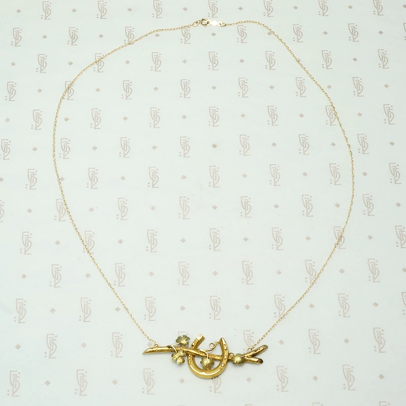 green rose and yellow gold 15ct horseshow and branch necklace