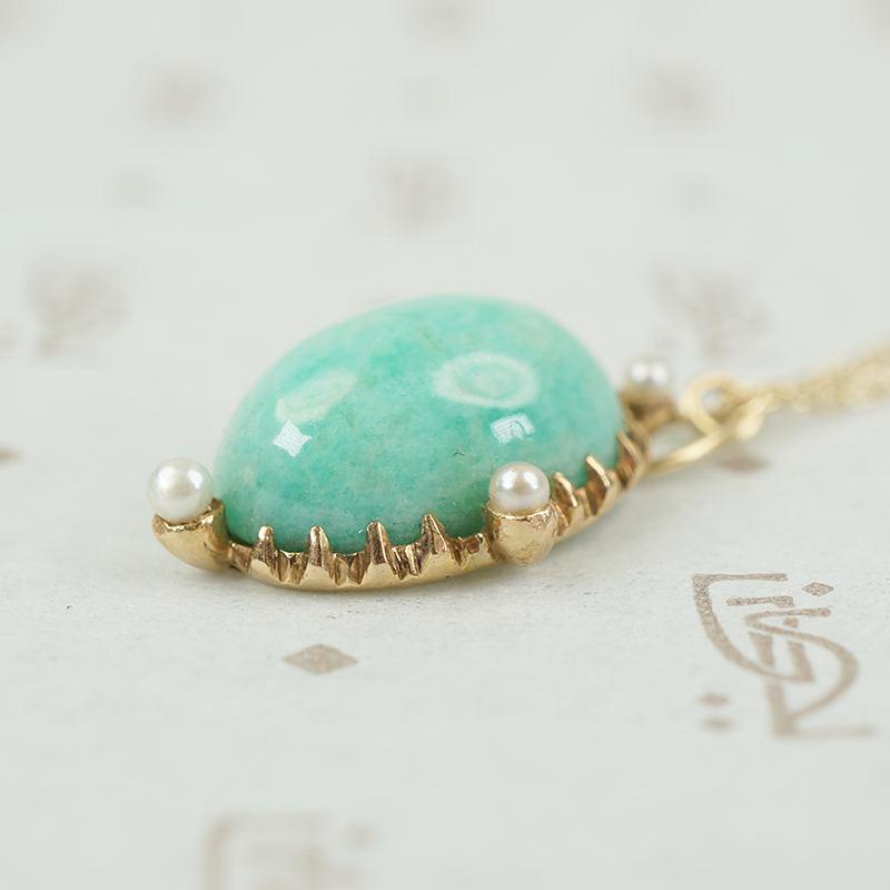 close up of side view showing details of amazonite and pearl pendant