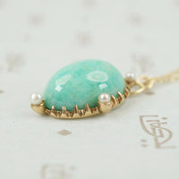 close up of side view showing details of amazonite and pearl pendant