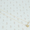 14k gold hatchet necklace back side