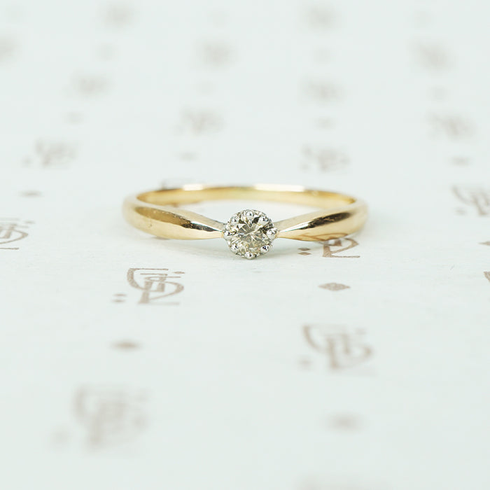 pinched shoulder platinum on gold champagne diamond solitaire