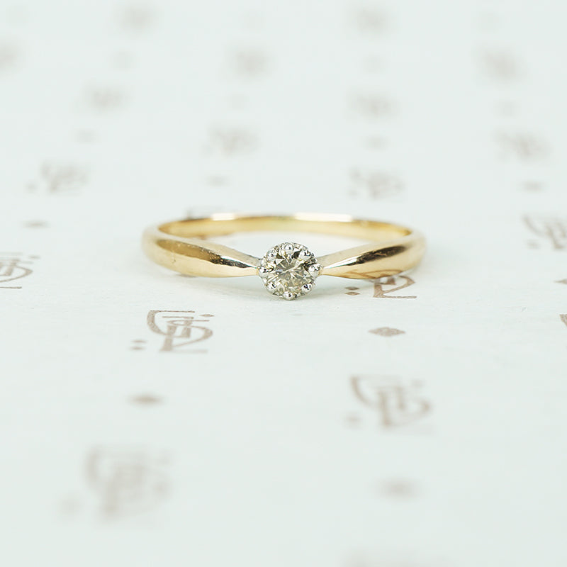 pinched shoulder platinum on gold champagne diamond solitaire