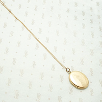 Elevated 18k Rose Gold Oval Locket
