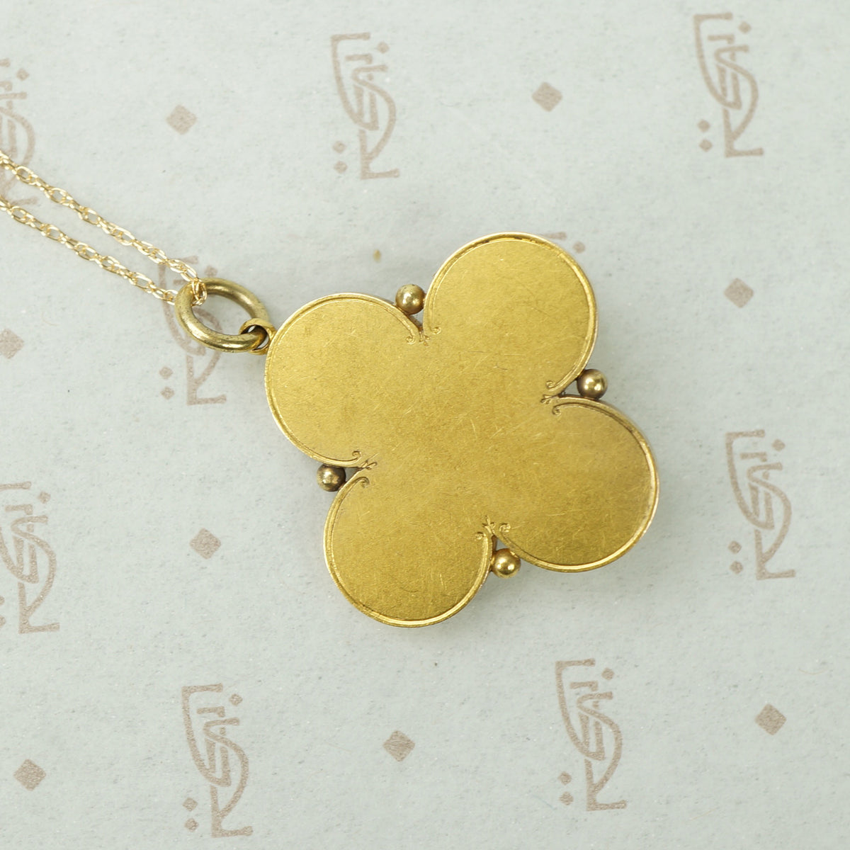 Elegant Quatrefoil Locket with Pearl