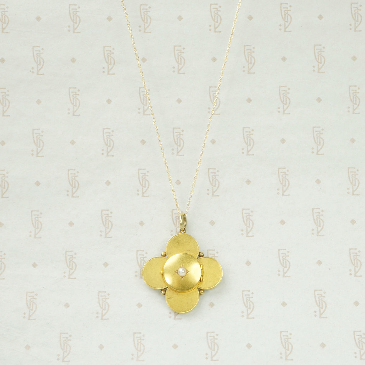 Elegant Quatrefoil Locket with Pearl