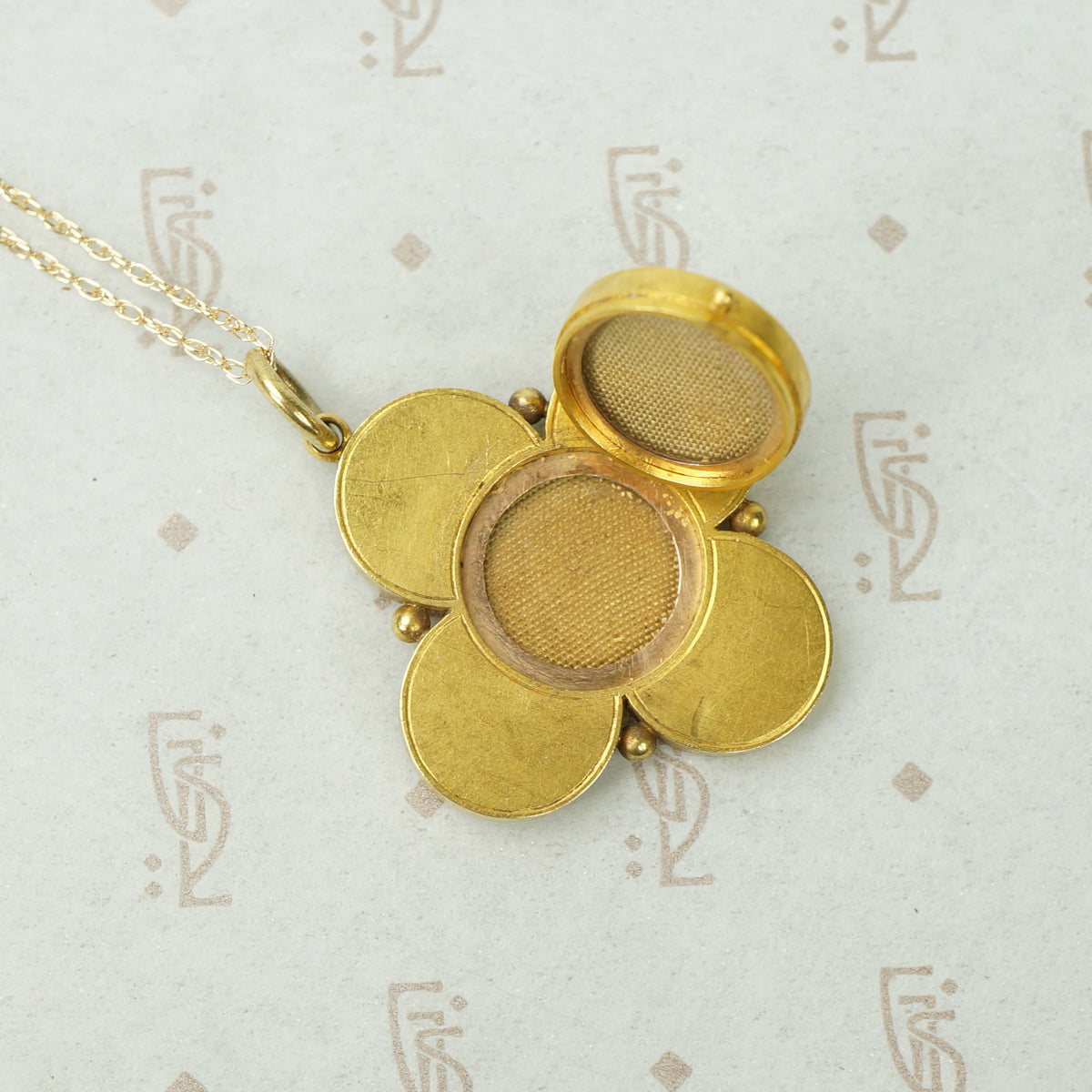 Elegant Quatrefoil Locket with Pearl