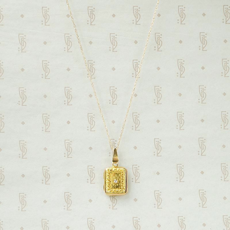 Delicate Gold Filigree Locket with Diamond Accent