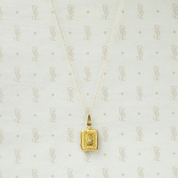 Delicate Gold Filigree Locket with Diamond Accent