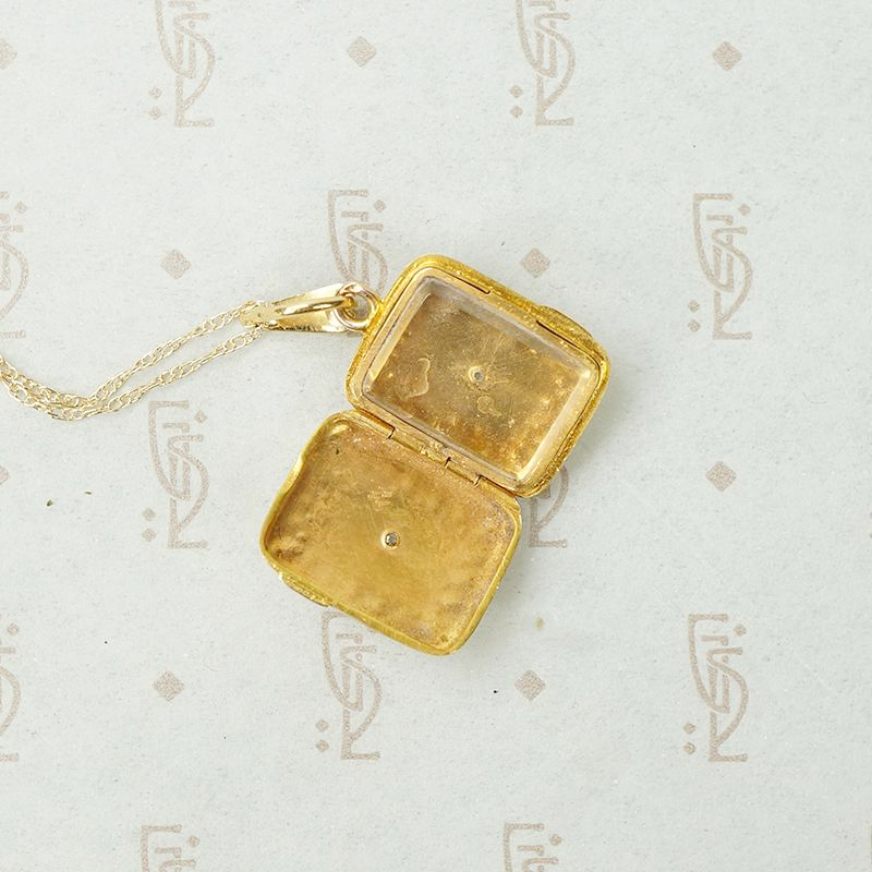 Delicate Gold Filigree Locket with Diamond Accent