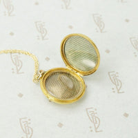 Luxurious Gold Locket with Ruby and Diamonds