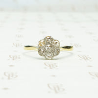vintage platinum on 18k yellow gold closed back diamond flower ring