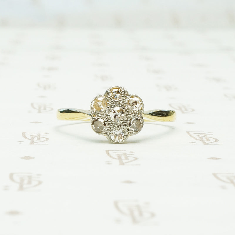 vintage platinum on 18k yellow gold closed back diamond flower ring