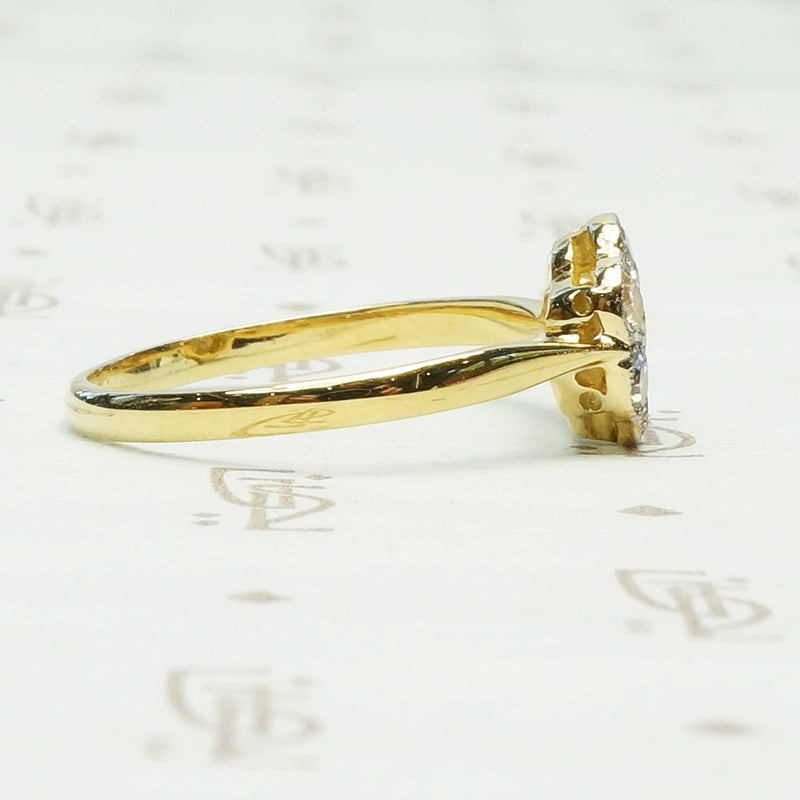 vintage platinum on 18k yellow gold closed back diamond flower ring
