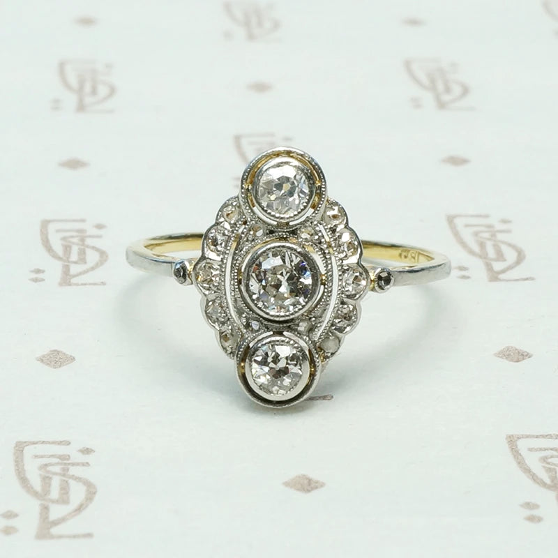 edwardian 3 diamond bezel set platinum on 18k marquis shaped ring
