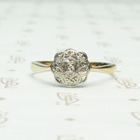 platinum on 9k yellow gold highly detailed flower shaped top with tiny diamonds