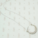 The White Gold Diamond Crescent Moon Necklace