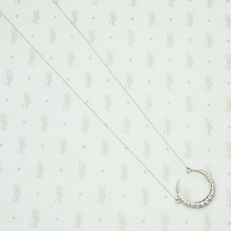 18k white gold crescent moon necklace set with round diamonds