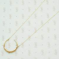 The 18k Gold and Pearl Crescent Moon Necklace