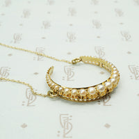 The 18k Gold and Pearl Crescent Moon Necklace
