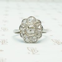 stunning platinum diamond halo ring circa 1910 with .75 tcw of diamonds