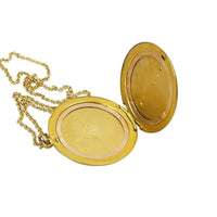 Antique Round Locket with hand engraved flowers and paste gems
