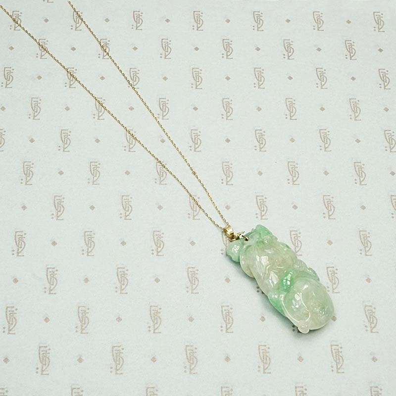 Auspicious Carved Jade Pendant with Pomegranate, Plum and Frog, back view.