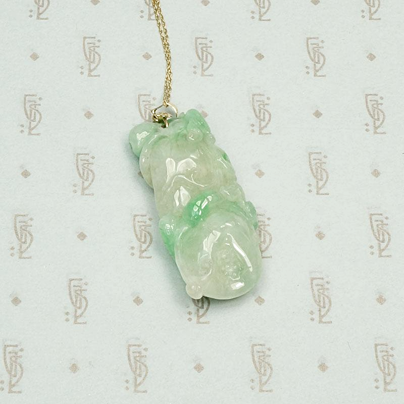 Auspicious Carved Jade Pendant with Pomegranate, Plum and Frog, detail view.