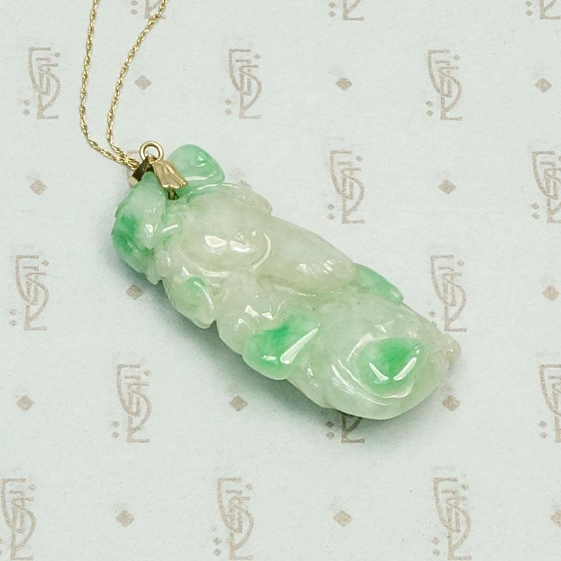 Auspicious Carved Jade Pendant with Pomegranate, Plum and Frog, detail view.