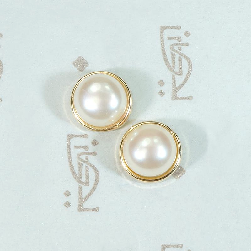 Creamy Half Pearls Nestled in Gold Bezel Studs