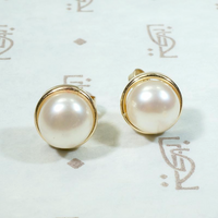 Creamy Half Pearls Nestled in Gold Bezel Studs