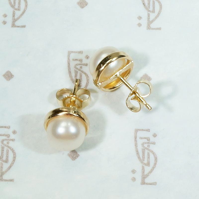 Creamy Half Pearls Nestled in Gold Bezel Studs