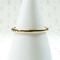 curved gold wedding band