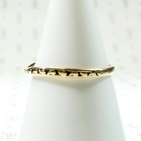curved gold wedding band