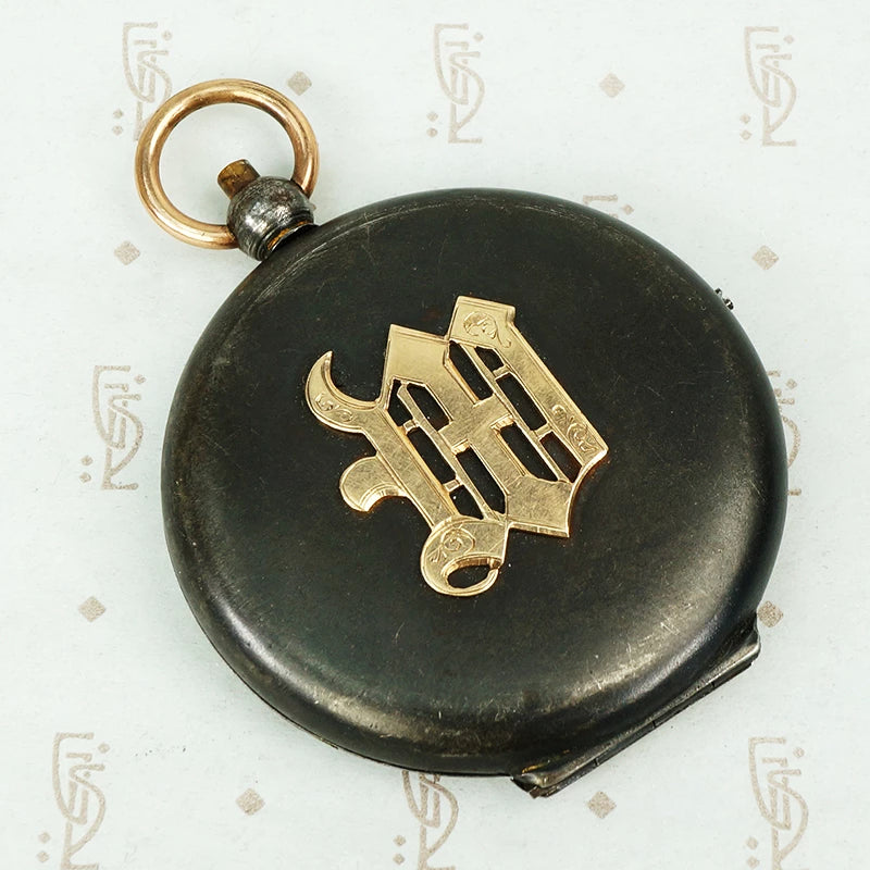 large gunmetal and rose gold locket with the letter M