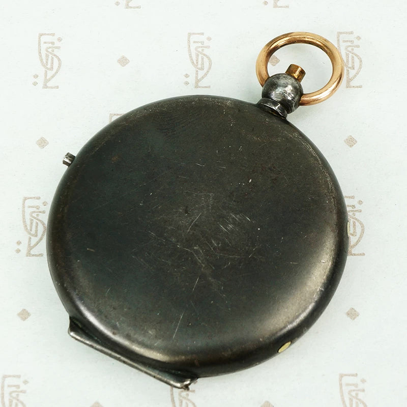 large gunmetal and rose gold locket with the letter M